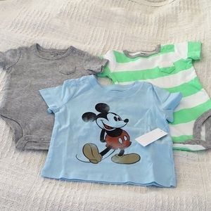 One Disney T-shirt, 2 Carter’s onesies. Brand-new.